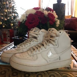 White Nike Air Force ones.